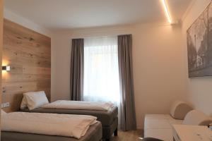 Letto o letti in una camera di Gasthof "Zur Kanne"