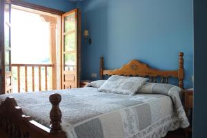 A bed or beds in a room at Posada Sobrevilla