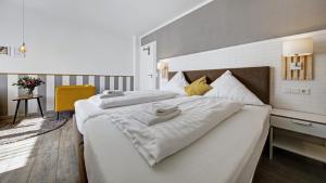 Un ou plusieurs lits dans un hébergement de l'établissement Neckarbett - Self Service Hotel