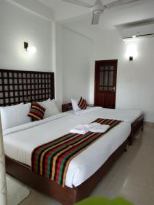 Кровать или кровати в номере Otha Shy Airport Transit Hotel