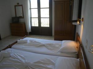 Cama ou camas em um quarto em Villa Frideriki