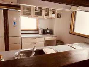 Kuchyň nebo kuchyňský kout v ubytování Hakuba Ski Condos