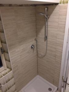 a bathroom with a shower with a toilet and a sink at Appartamento Tipico Sul Molo in Lerici