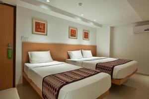 Postel nebo postele na pokoji v ubytování Hotel Leafio-Near Airport