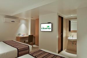 Postel nebo postele na pokoji v ubytování Hotel Leafio-Near Airport + 23 fotografií