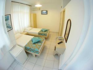 Postel nebo postele na pokoji v ubytování Kleopatra Carina Hotel