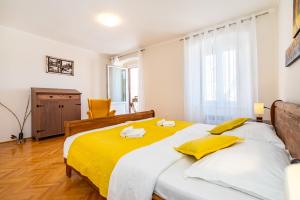 Postel nebo postele na pokoji v ubytování Apartment Caesar by Belmont Realty