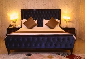 Postel nebo postele na pokoji v ubytování Qasr AlDur Hotel + 37 fotografií