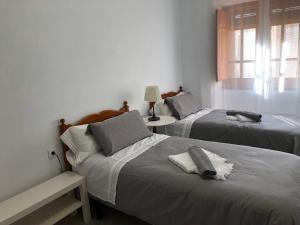Ένα ή περισσότερα κρεβάτια σε δωμάτιο στο Apartamento SC Victoria