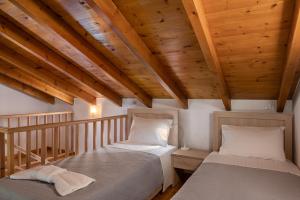 Postel nebo postele na pokoji v ubytování Androulakis Apartments + 37 fotografií