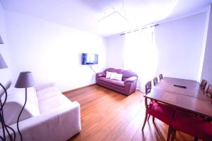 a living room with a couch and a table at 1Dest - City Heart in Riva del Garda