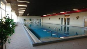 a large indoor swimming pool in a building at Ferienwohnung "Traumblick" - Selbstversorger in Braunlage