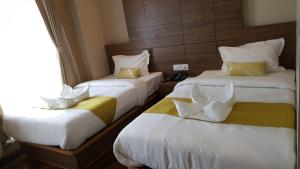 A bed or beds in a room at Hotel Bihani