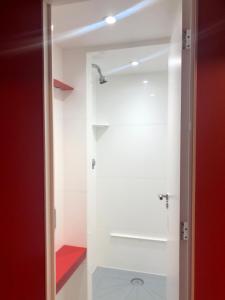 a bathroom with a shower with a glass door at Copenhagen Downtown Hostel in Copenhagen