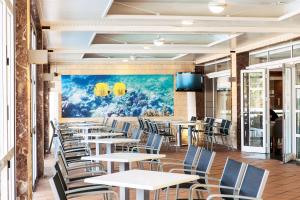 Reštaurácia alebo iné gastronomické zariadenie v ubytovaní Hotel Mariant