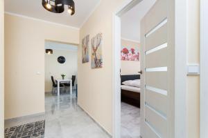 Posteľ alebo postele v izbe v ubytovaní Apartments Kraków Zablocie by Noclegi Renters