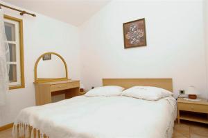 Säng eller sängar i ett rum på Winery Bačić