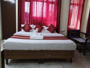 Cama ou camas em um quarto em Raj Laxmi Bhawan