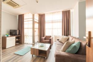 a living room with a couch and a table at Balkan Hotel Garni in Belgrade