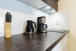 Kuchyňa alebo kuchynka v ubytovaní Apartments Kraków Zablocie by Noclegi Renters