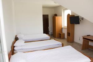 Ένα ή περισσότερα κρεβάτια σε δωμάτιο στο Willa u Piotra