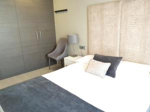 Posteľ alebo postele v izbe v ubytovaní Apartamentos Real Lleida