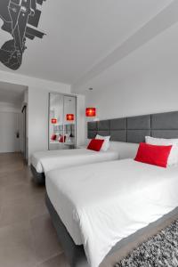 Uma cama ou camas num quarto em Rossio Hotel
