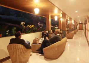 a group of people sitting in chairs in a restaurant at Zone Connect by The Park Mount Siniolchu, Gangtok in Gangtok