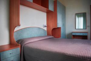 Postel nebo postele na pokoji v ubytování Hotel Martinez