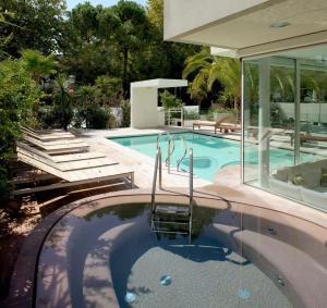 a swimming pool in a house at Hotel Select Suites & Spa - Apartments in Riccione