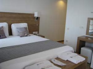 A bed or beds in a room at Rhapsody Hotel Kas