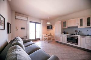 A kitchen or kitchenette at Kelly Apartments Cefalù