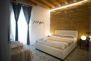 Postel nebo postele na pokoji v ubytování B&B Kolymbetra