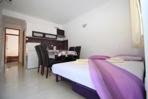 Ein Bett oder Betten in einem Zimmer der Unterkunft Apartments Pitarević