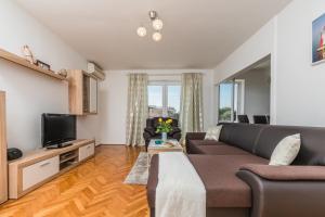 TV a/nebo společenská místnost v ubytování Apartment Marty