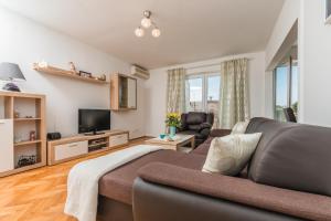 TV a/nebo společenská místnost v ubytování Apartment Marty