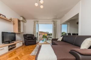 TV a/nebo společenská místnost v ubytování Apartment Marty