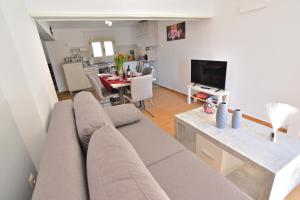 Televízia a/alebo spoločenská miestnosť v ubytovaní Villa Ela Ferienappartements