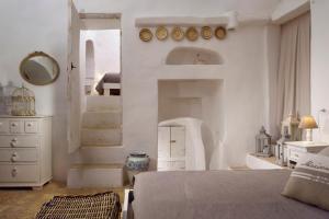 Postel nebo postele na pokoji v ubytování B&B Trullo Barbagiullo