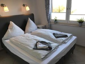 Tempat tidur dalam kamar di Wohnen am Wanderweg