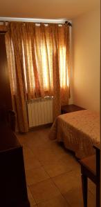 Un pat sau paturi într-o cameră la Hotel Vitalba