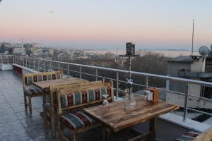 a table and chairs on top of a balcony at Reggae Apart Hotel in Istanbul