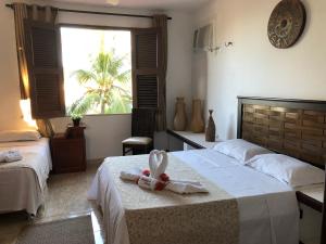 A bed or beds in a room at Shekinah House