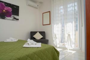 A bed or beds in a room at Green Residence