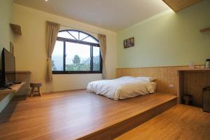 Postel nebo postele na pokoji v ubytování New Live B&B
