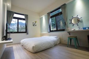 Postel nebo postele na pokoji v ubytování New Live B&B