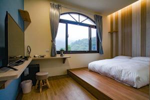 Postel nebo postele na pokoji v ubytování New Live B&B