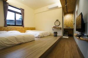Postel nebo postele na pokoji v ubytování New Live B&B