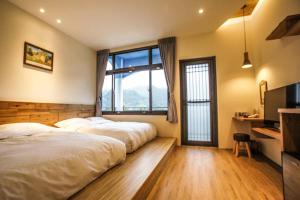 Postel nebo postele na pokoji v ubytování New Live B&B