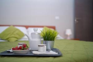 A bed or beds in a room at Green Residence